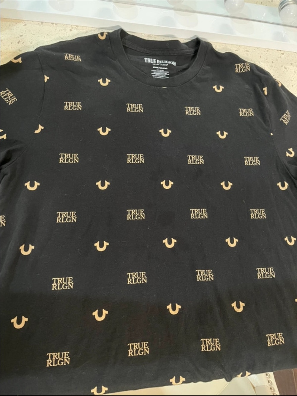True Religion Black Tee with Tan Logo Allover Print Pattern